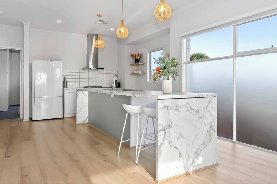 Pull up a stool at the kitchen island for a casual breakfast or a glass of McLaren Vale wine while dinner comes together.