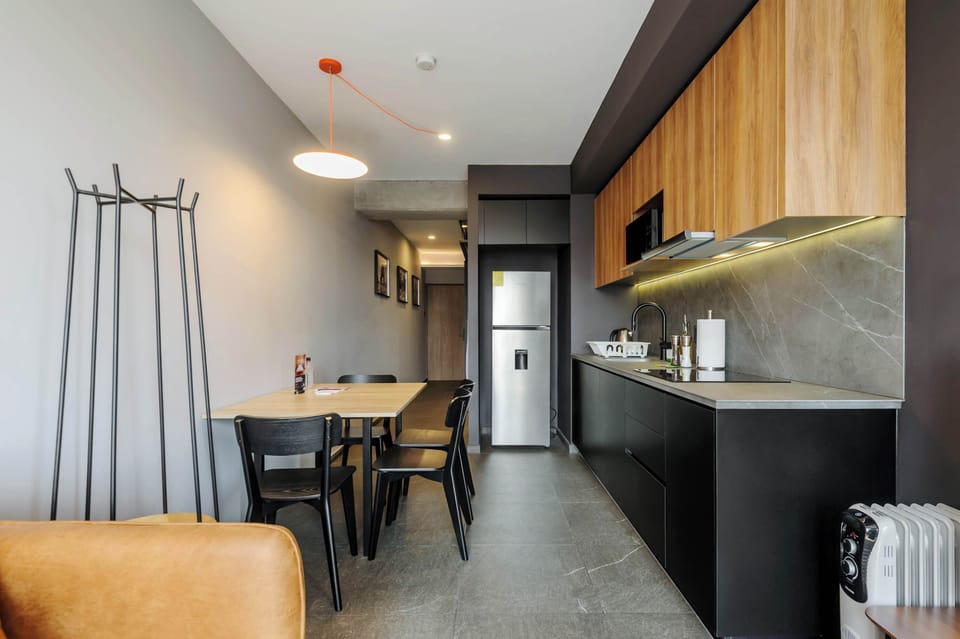 Integrated living and dining area with modern design.
