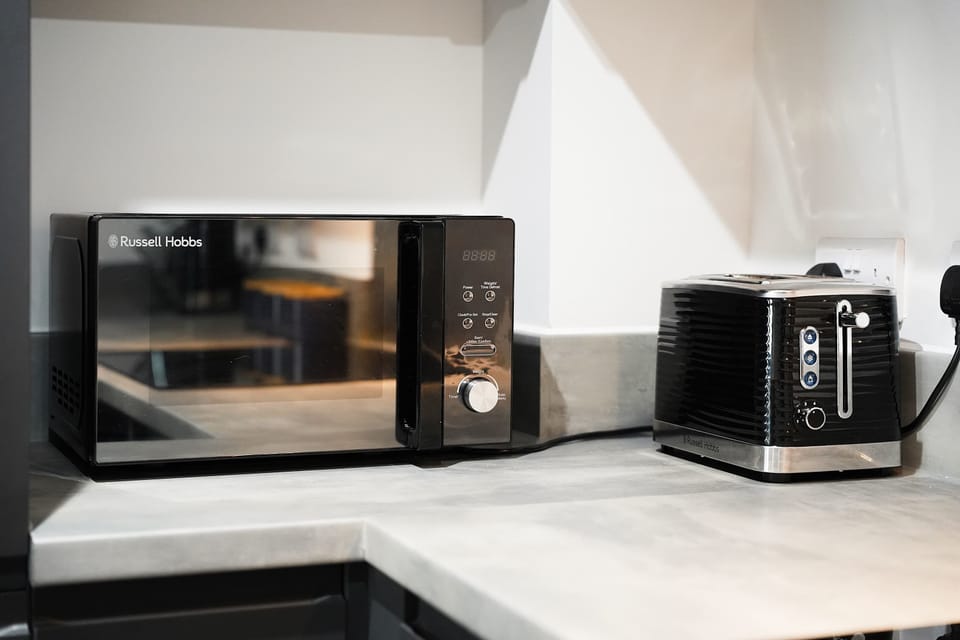Enjoy added convenience with a microwave oven and toaster — perfect for quick breakfasts, snacks, and easy meal preparation during your stay.