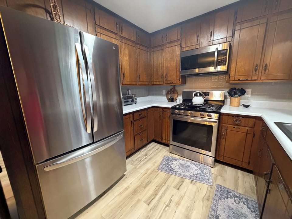 Cook with ease in the fully stocked kitchen featuring modern appliances