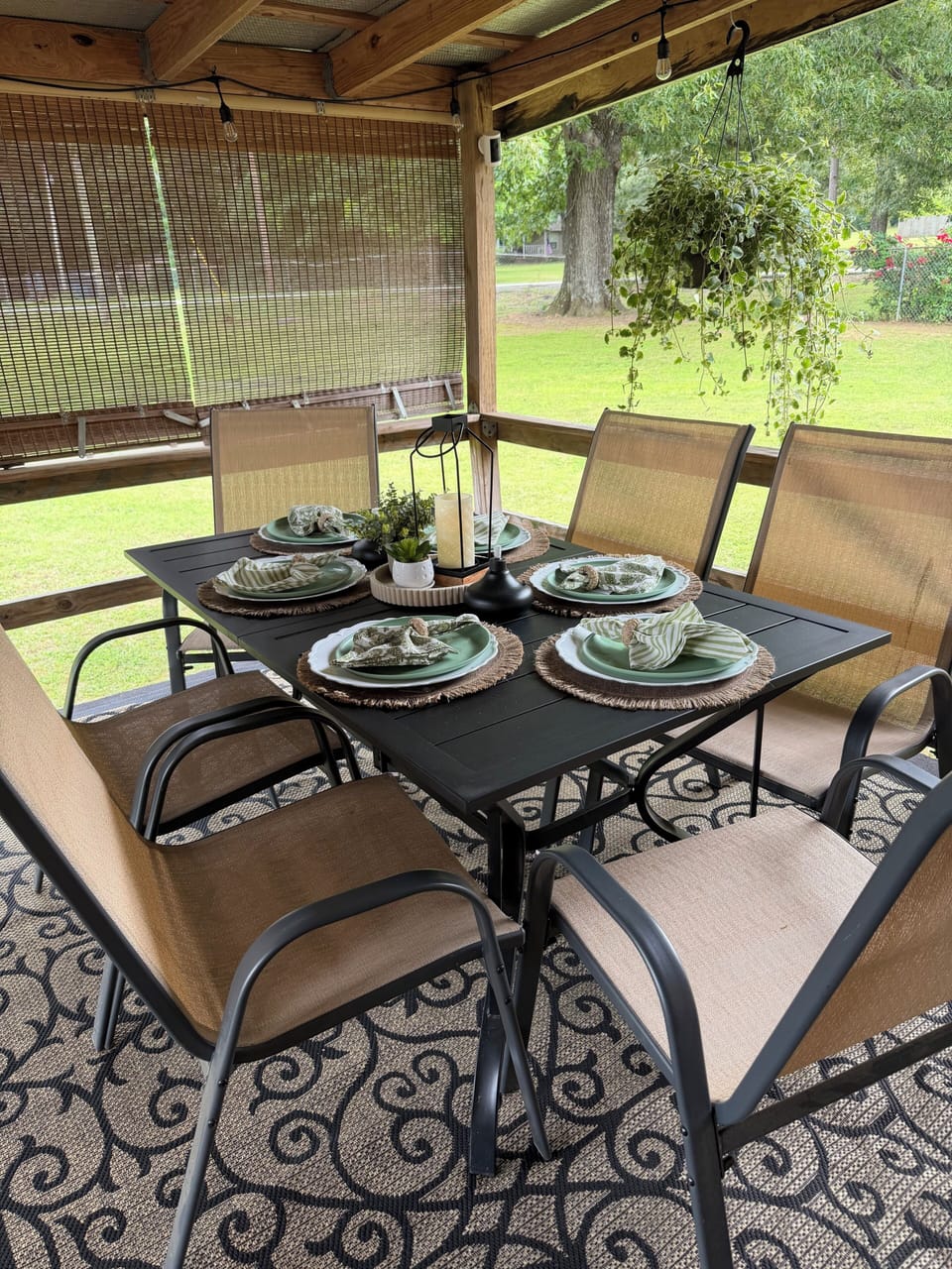 Covered outdoor dining area with seating for six