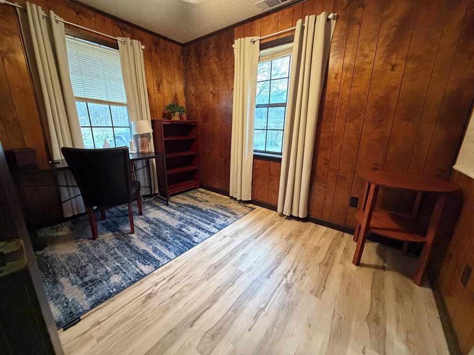 Dedicated workspace with desk, chair, and natural light