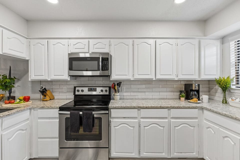 Kitchen | Stainless Steel Appliances | Upper Cabinets & Tile Backsplash