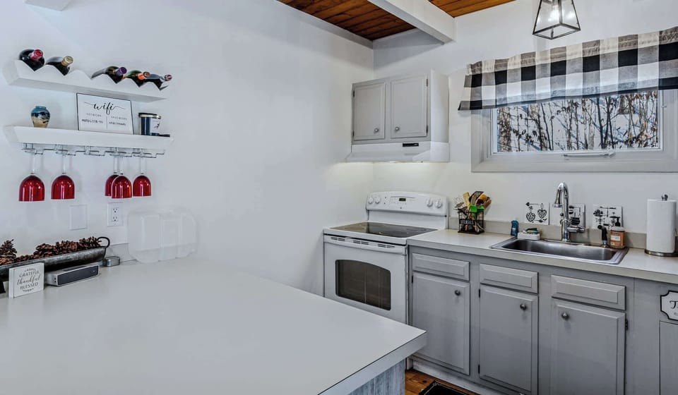 Kitchen wine bar with wifi info, Bluetooth speaker, and farmhouse touches