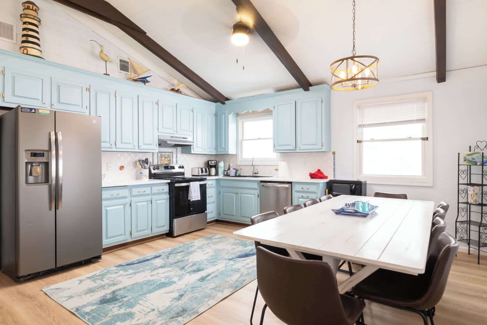 Top Level: Fully Stocked Kitchen & Dining Area