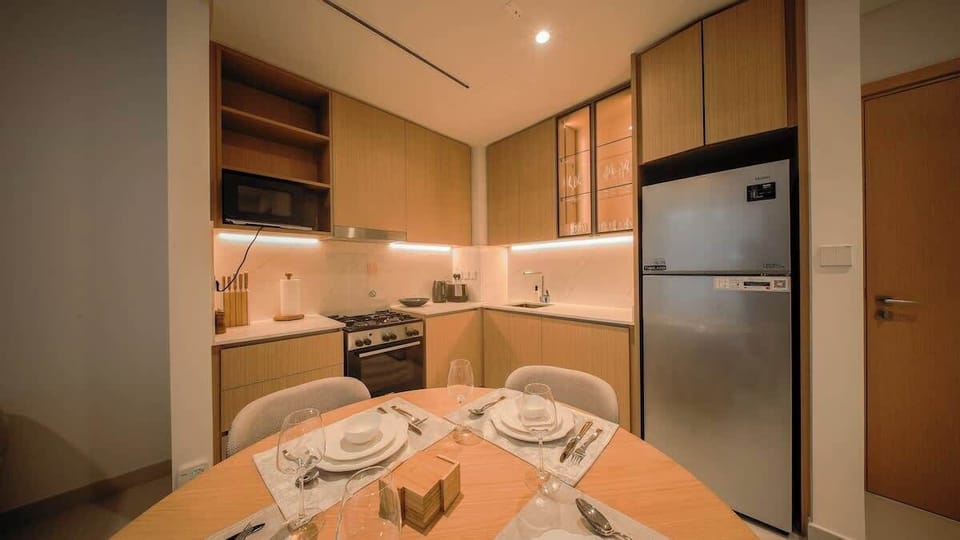 Fully equipped kitchen with dining setup.