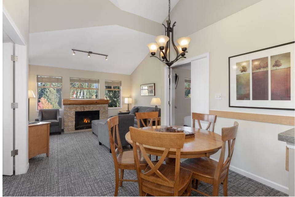 Share a relaxed meal beneath warm lights, steps from the fire.