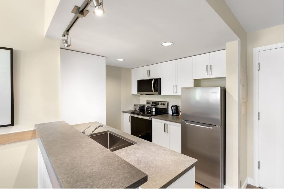 Cook with ease on sleek counters and full modern appliances.