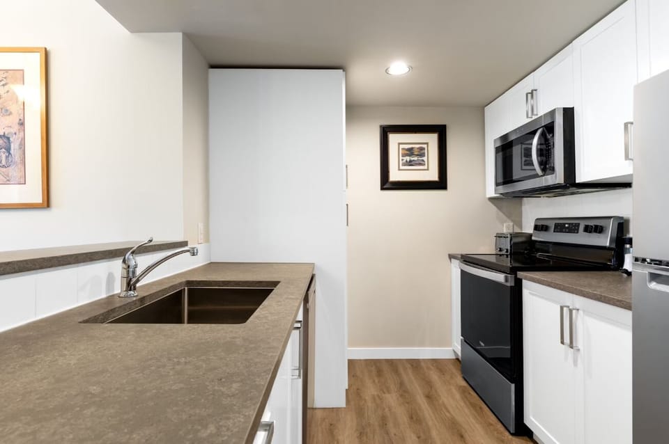 Prep meals comfortably with ample counters and updated appliances.