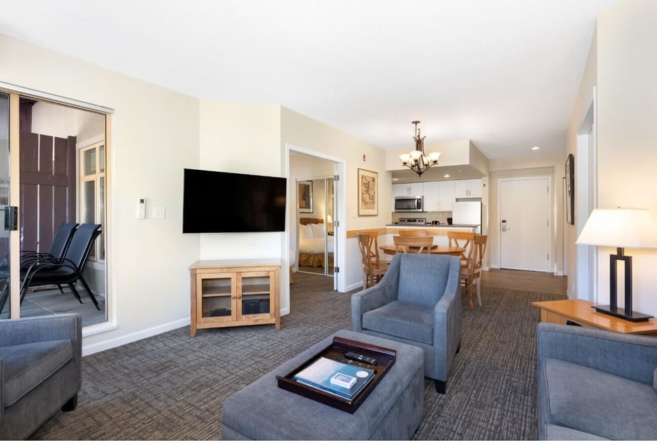 Gather for movie nights with open living-to-kitchen flow.