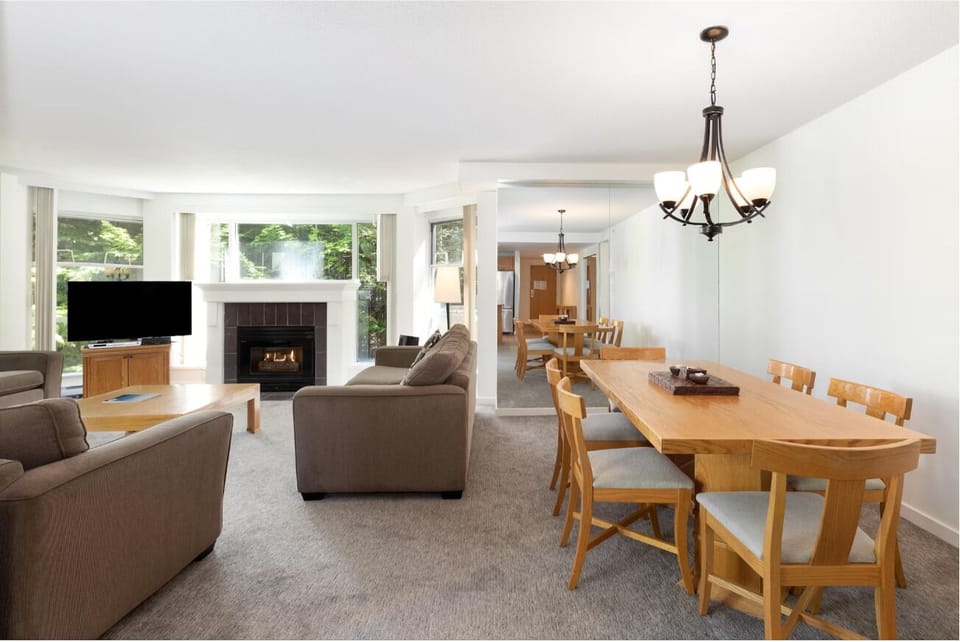 Gather for cozy meals beside the glowing fireplace and lounge.