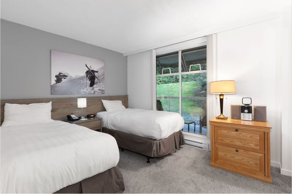 Settle in comfortably with bedside lighting and extra space.