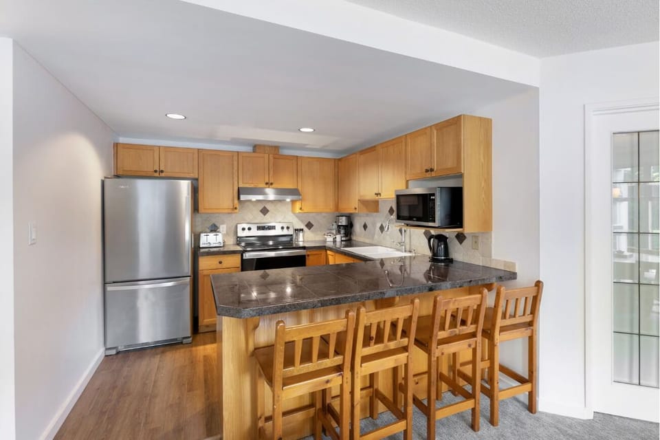Cook together at the spacious breakfast bar and granite counters.