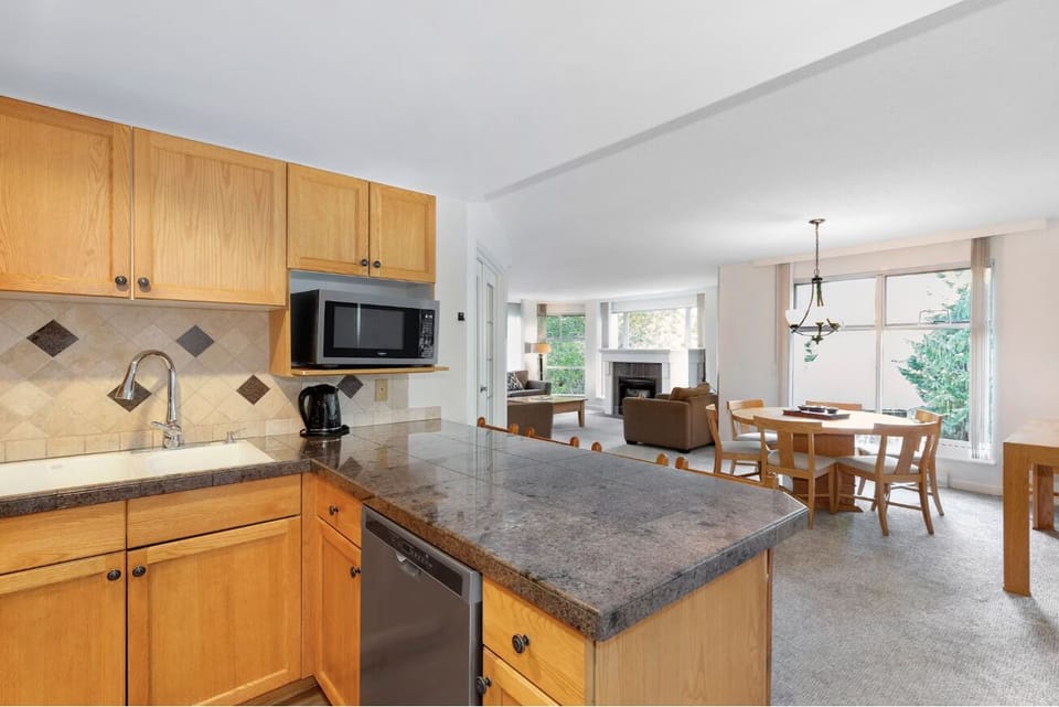 Gather effortlessly in the airy open-plan living and dining.