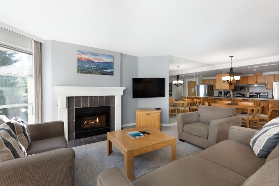 Cozy up by the fireplace after a day outdoors.