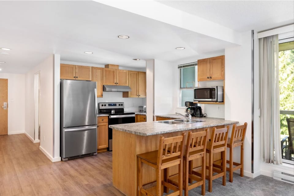 Gather at the breakfast bar for easy meals and chats.