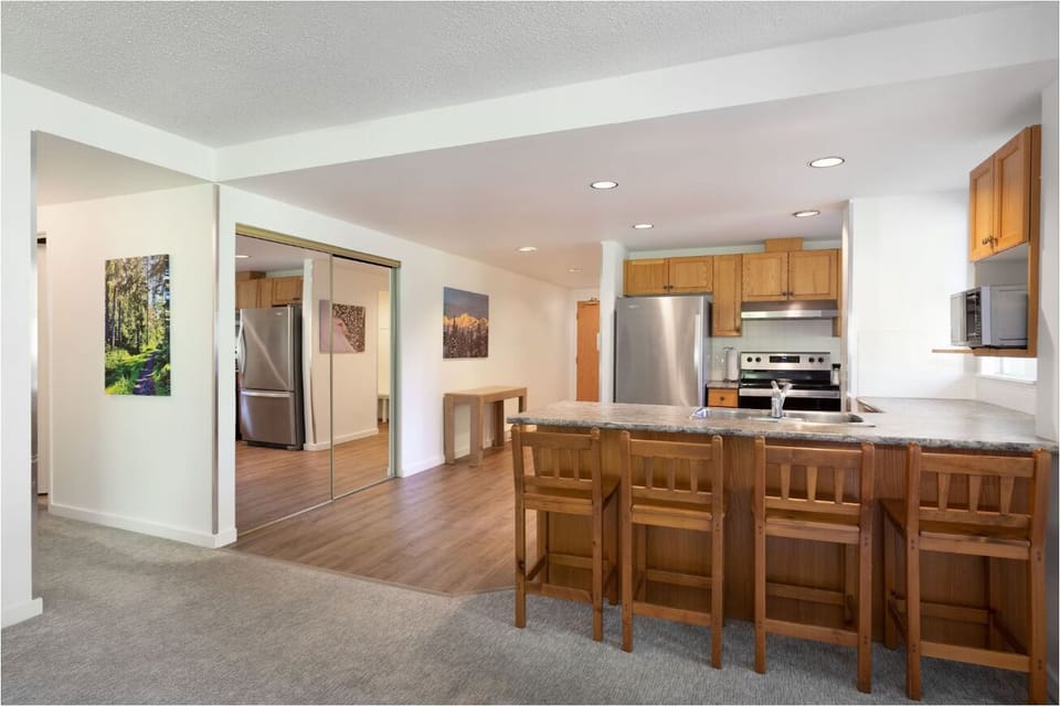 Start meals easily with full kitchen, stainless appliances, and bar.