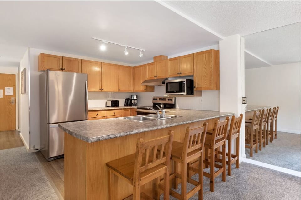 Cook together at the breakfast bar with full-size appliances.