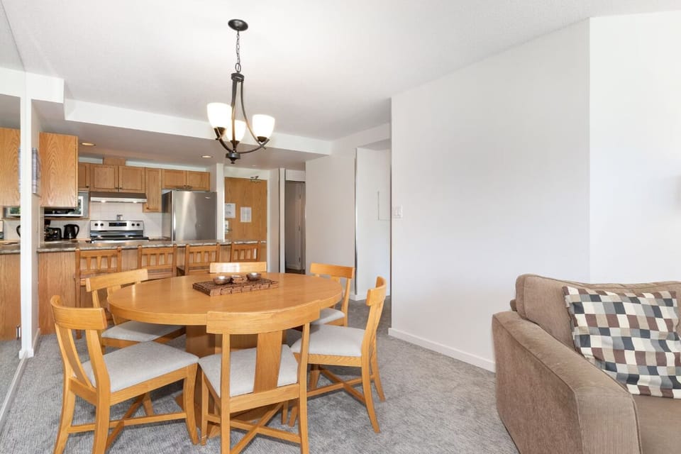Gather for cozy meals in this bright open-plan space.