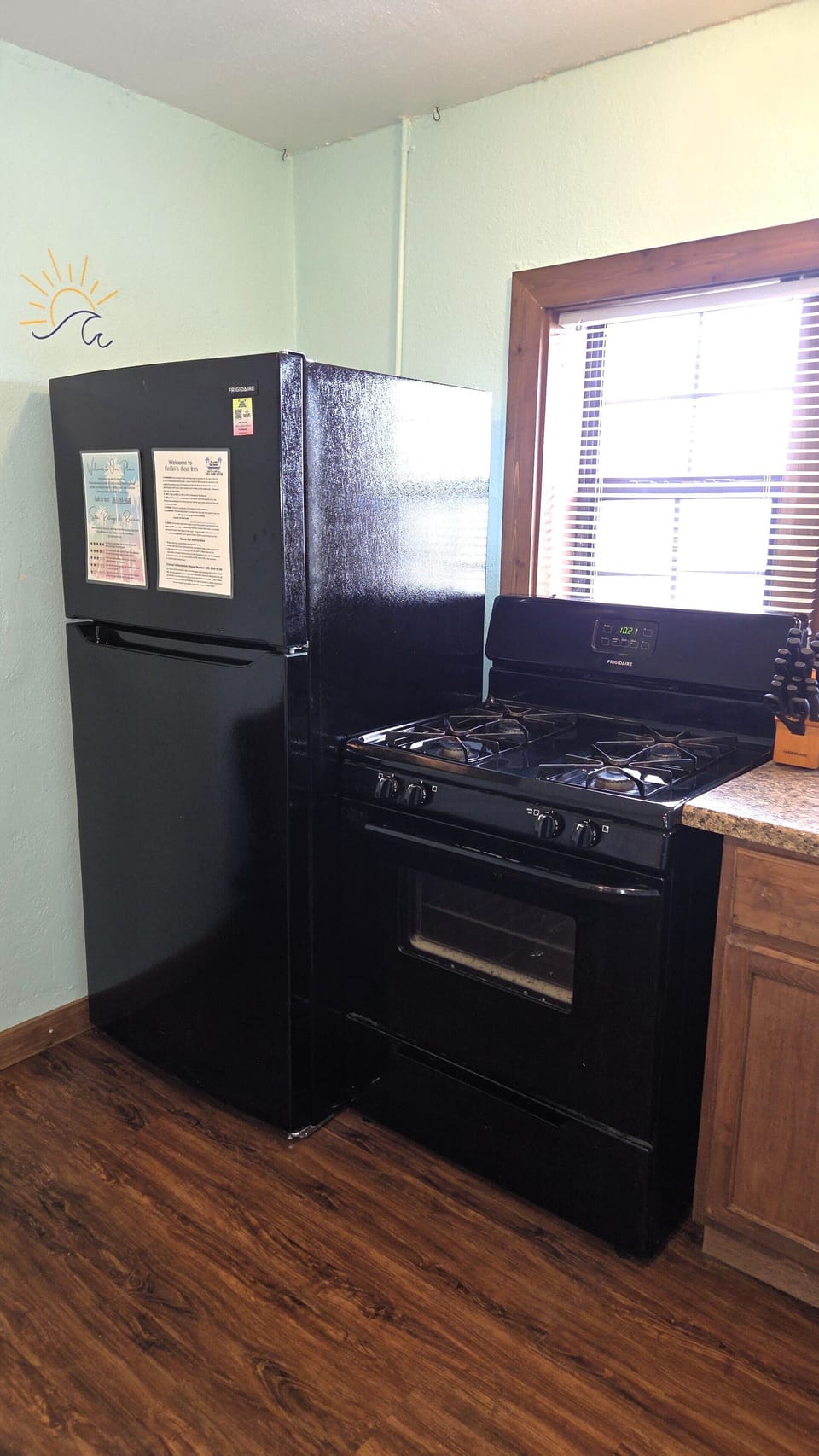 A full-size refrigerator and gas stove are provided.