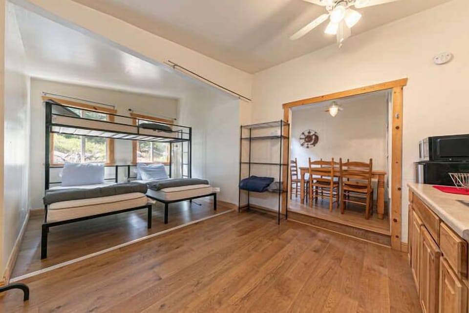 Open layout connecting the sleeping space, kitchenette, and dining nook, creating a functional and comfortable environment for extended stays.
