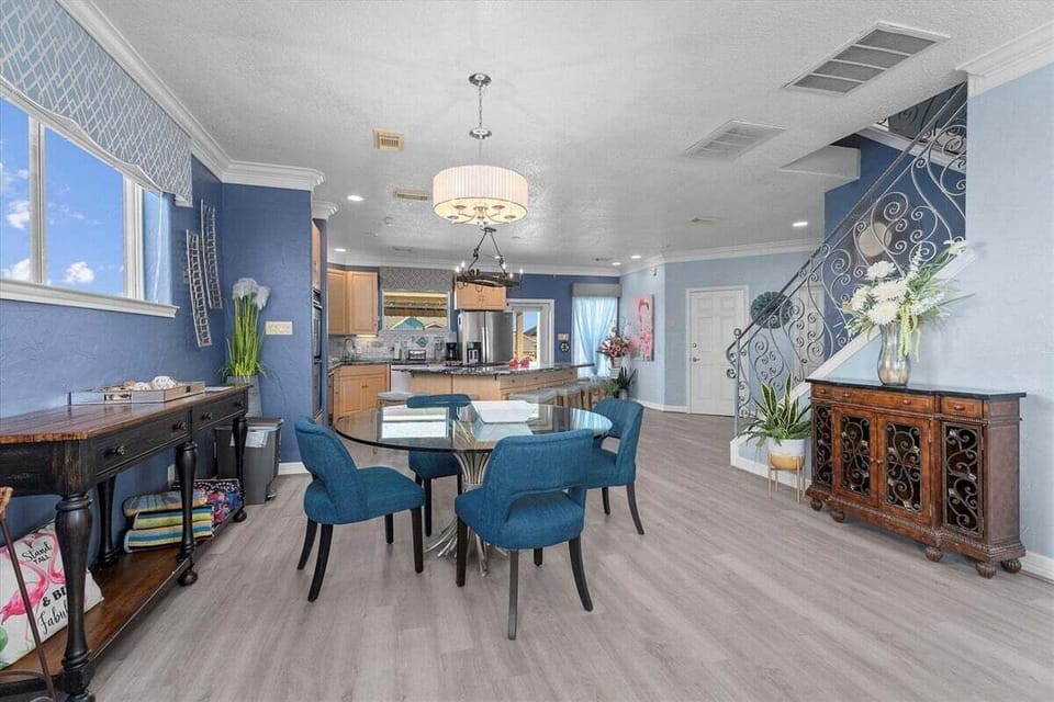 Spacious open-concept dining room overlooking the kitchen, with seating for six, abundant natural light and convenient access to the home's main living areas.