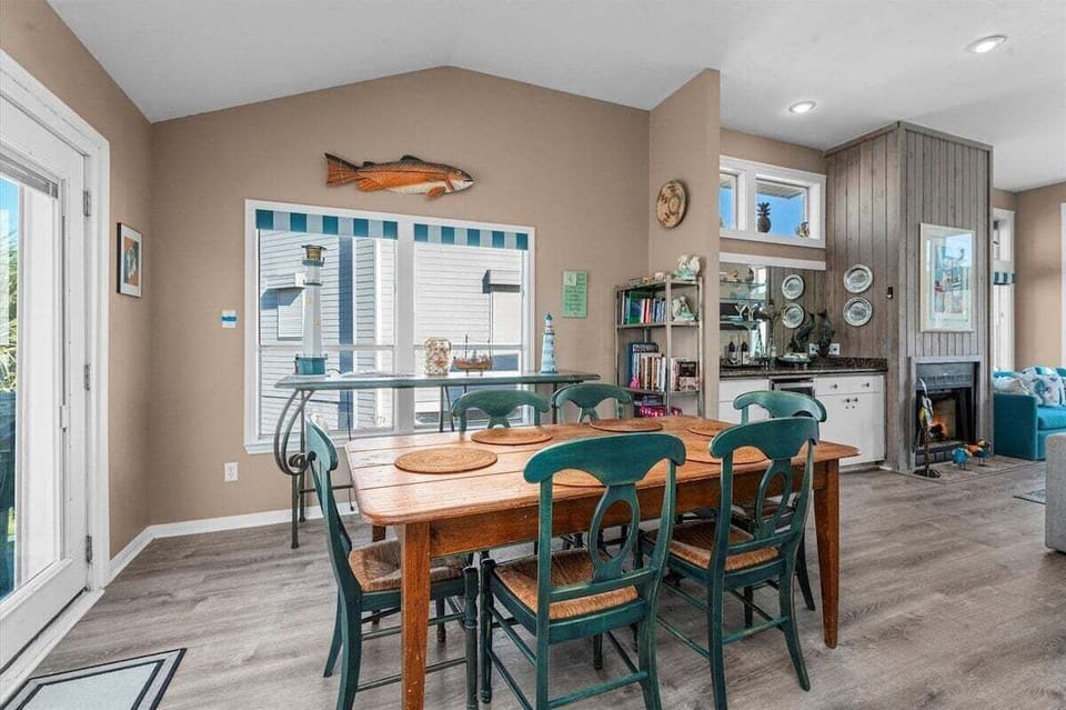 Open dining room with generous seating and easy access to the kitchen and living areas. Designed for entertaining large groups comfortably.