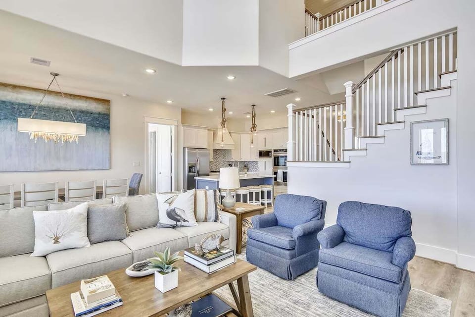 Elegant main living space with modern furnishings, open layout, and seamless flow to kitchen and dining areas.