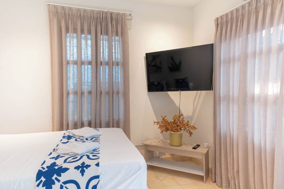 Standard Quadruple Room, Courtyard View | WiFi (free), bed sheets