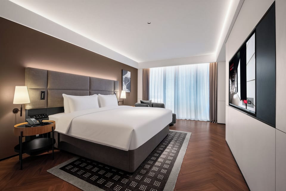 Luxury Suite, City View | Down comforters, free minibar, in-room safe, individually decorated