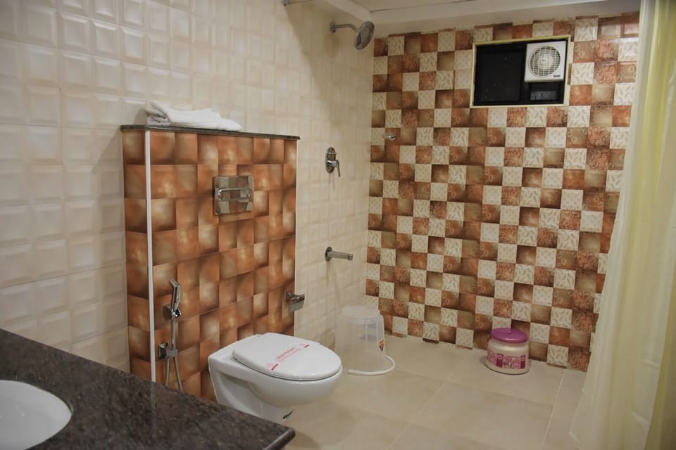 Shower, rainfall showerhead, towels, soap