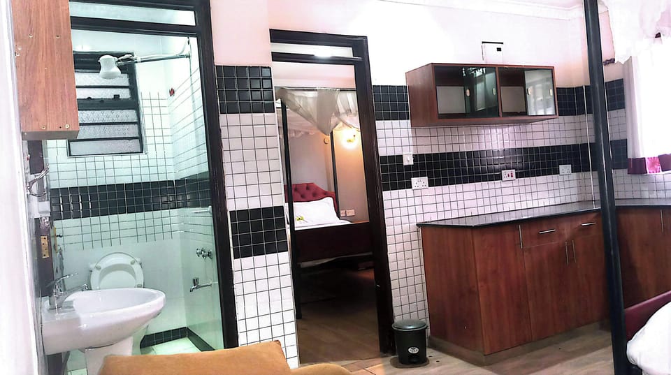 Separate tub and shower, slippers, towels, soap