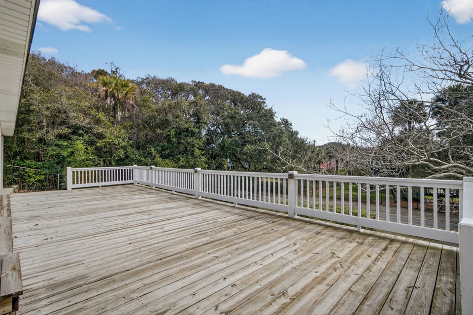 Spacious wraparound deck with a screened porch—perfect for morning coffee, sunset chats, and fresh coastal air.