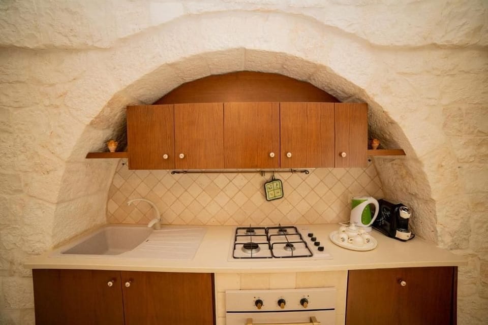 Classic House, Patio, Courtyard View (Trullo Ulivo) | Private kitchen | Fridge, highchair, cookware/dishes/utensils