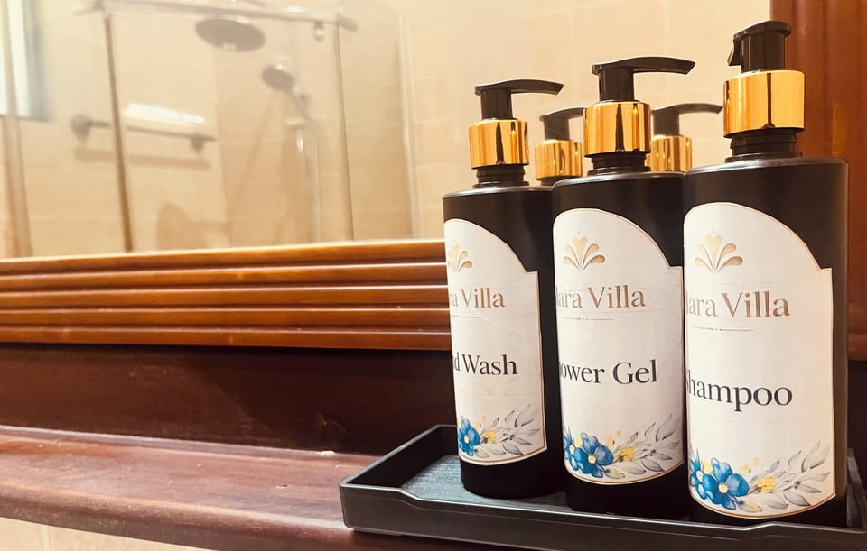 Separate tub and shower, towels, soap, shampoo
