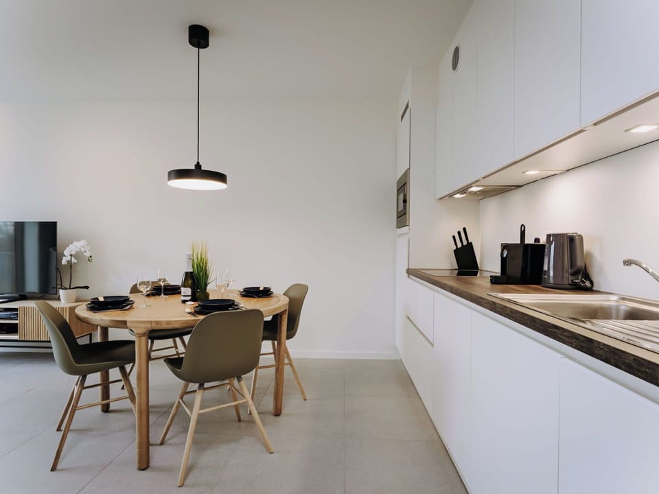Furniture, Interior Design, Flooring, Wood, Light Fixture, Ceiling, Kitchen & Dining Room Table, Countertop, Floor, Lighting