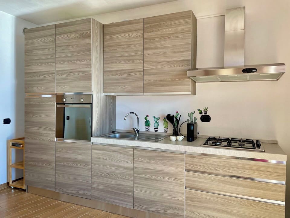 Wood, Kitchen, Countertop, Cabinetry, Kitchen Appliance, Flooring, Furniture, Home Appliance, Wood Stain, Cupboard