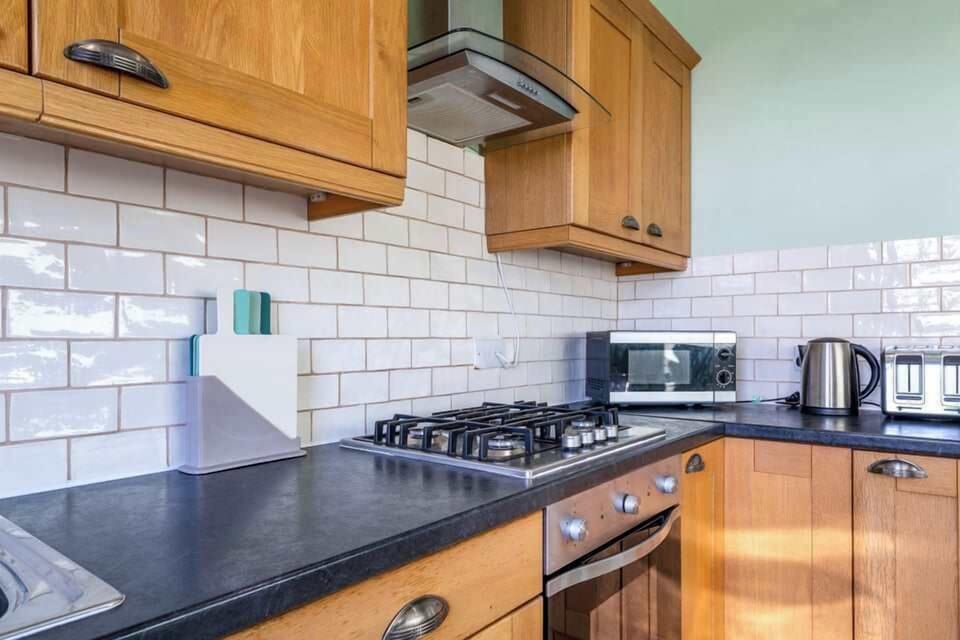Bright kitchen offering sea views and everything needed for your stay