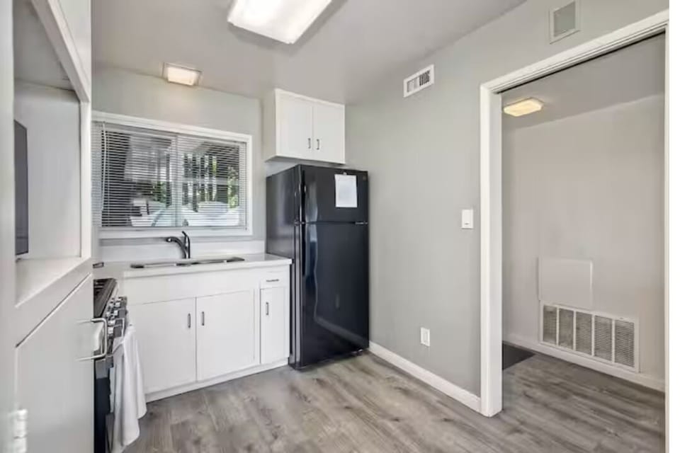 Prepare meals in this fully equipped, modern kitchen featuring spacious countertops, top-notch appliances, and bright open design. Perfect for cooking breakfast before a beach day or enjoying casual meals with family and friends.