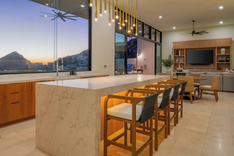 Cook with stunning mountain views from your sleek marble kitchen island, complete with modern bar seating for memorable meals.