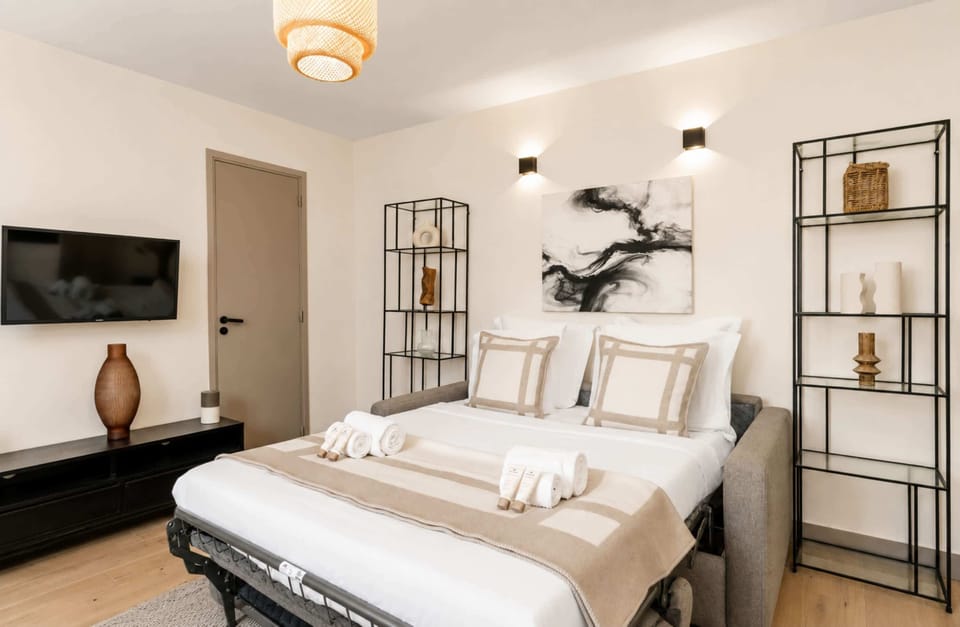Double sofa bed providing a cozy and flexible sleeping arrangement in the living room.