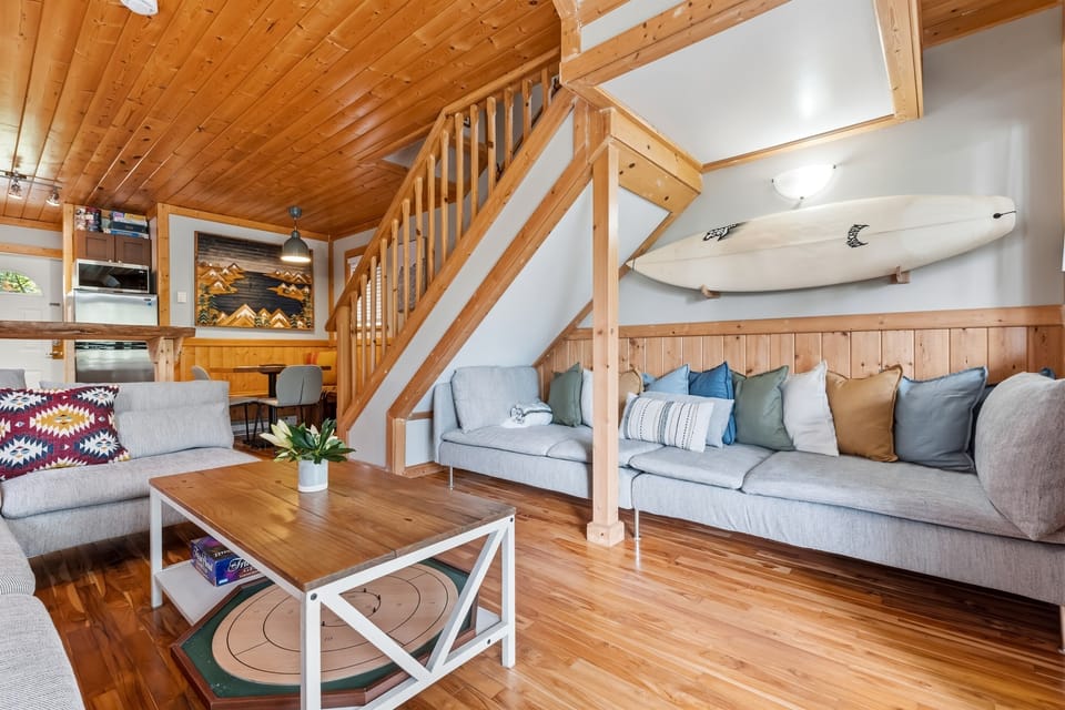 Two cozy couches create the perfect gathering space to relax and enjoy board games together.