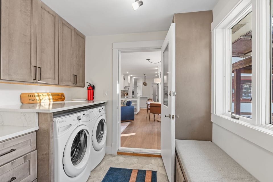 Your dedicated laundry room keeps your vacation wardrobe fresh with modern appliances and ample storage.