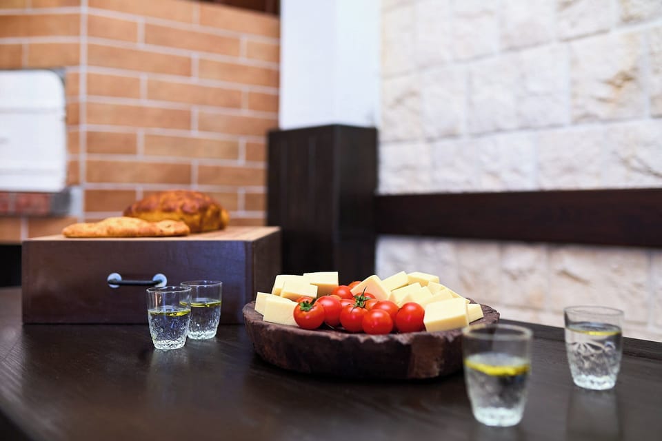 Savor local flavors in the authentic 'Konoba' cellar, a rustic space perfect for tasting regional cheese, fresh bread, and spirits.
