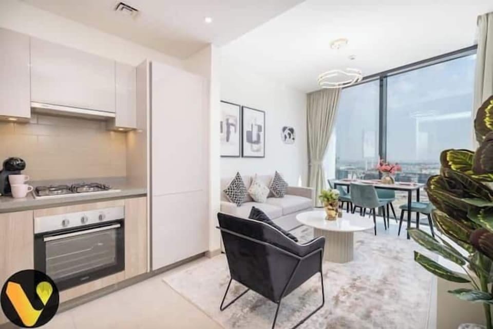 Luxury Apartment, Balcony, City View | Living area | 65-inch Smart TV with cable channels