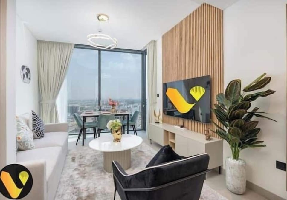 Luxury Apartment, Balcony, City View | Living area | 65-inch Smart TV with cable channels
