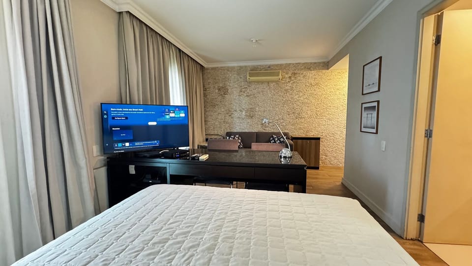 Deluxe Double Room | Minibar, desk, blackout drapes, iron/ironing board