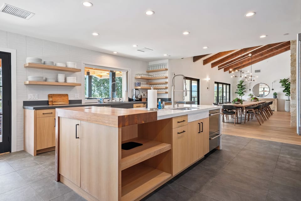 A high-end culinary hub offering a professional-grade island that provides an effortless transition from prep to party.