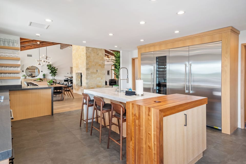 Entertain with ease from the chef’s kitchen with top-tier appliances to the dining table.