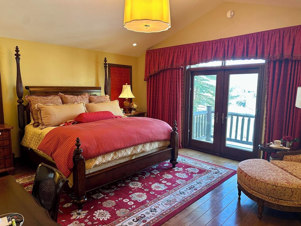 Primary bedroom with blackout drapes